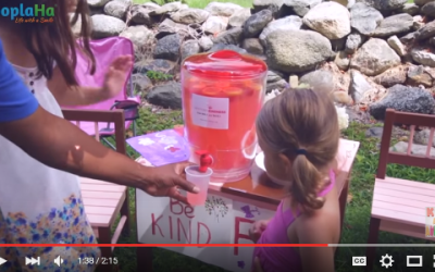A Lemonade Stand Serving Cups Of Kindness